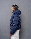 BUSI Puffer Jacket Navy down puffer jacket, side view on model
