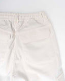 White corduroy pants on a white background