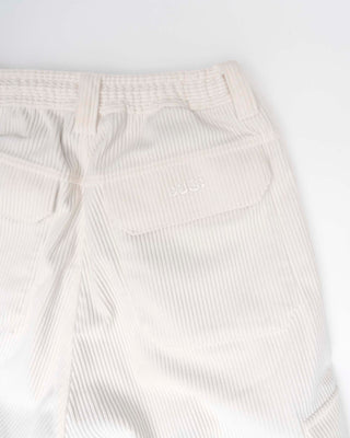 White corduroy pants on a white background
