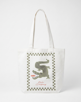 Tote bag with crocodile design and 'BUSI' text on a white background