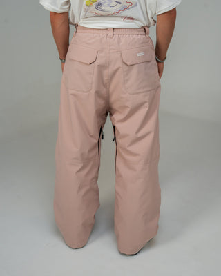 BUSI Biggie Pant Dusty Pink snowboard and ski pants, back view on male model