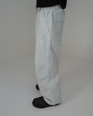 BUSI Biggie Pant Light Grey snowboard and ski pants, side view on model