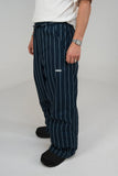 BUSI Biggie Pant Pinstripe snowboard and ski pants, side view on model