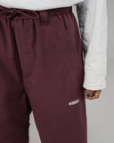 BUSI Biggie Pant Wine snowboard and ski pants, thigh logo detail