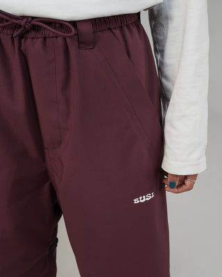 BUSI Biggie Pant Wine snowboard and ski pants, thigh logo detail