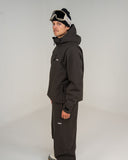 BUSI Core Jacket Brown snowboard and ski jacket, side view on model