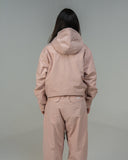 BUSI Core Jacket Dusty Pink snowboard and ski jacket, back view on model