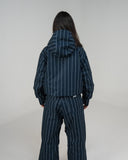 BUSI Core Jacket Pinstripe snowboard and ski jacket, back view on female model