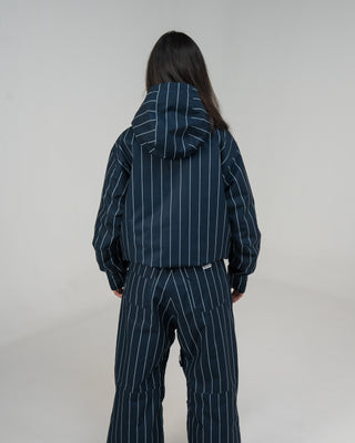 BUSI Core Jacket Pinstripe snowboard and ski jacket, back view on female model