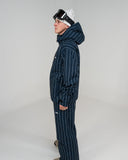 BUSI Core Jacket Pinstripe snowboard and ski jacket, side view on male model