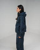 BUSI Core Jacket Pinstripe snowboard and ski jacket, side view on female model