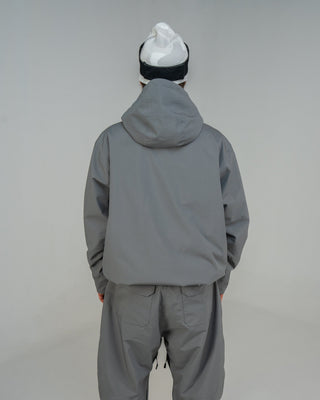 BUSI Core Jacket Steel Grey snowboard and ski jacket, back view on model