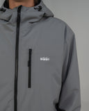BUSI Core Jacket Steel Grey snowboard and ski jacket, chest pocket and logo detail