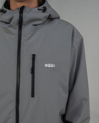 BUSI Core Jacket Steel Grey snowboard and ski jacket, chest pocket and logo detail