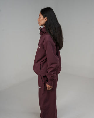 BUSI Core Jacket Wine snowboard and ski jacket, side view on model
