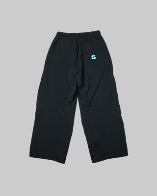 Black pants with a small logo on a white background
